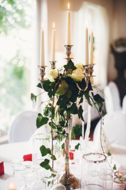Candle on the table at the wedding party.