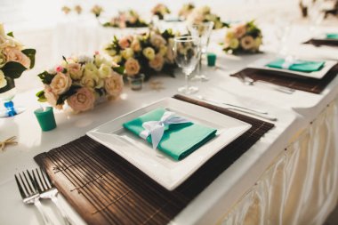 Decorated served table for wedding party or other event.