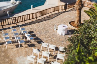 Outdoor wedding ceremony on the rocks by the sea.
