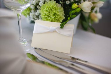 Nameplate for a guest on the table at a wedding party.