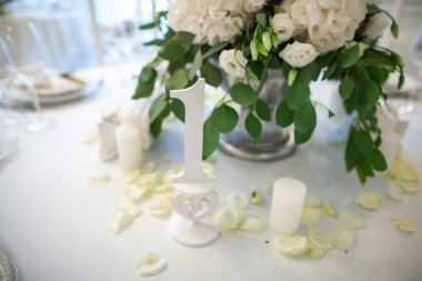 Sign showing table number at wedding party.