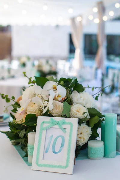 Sign showing table number at wedding party.