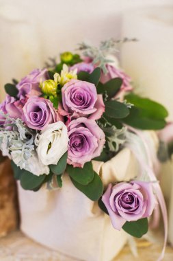 Colorful wedding bouquet in a fabric box.