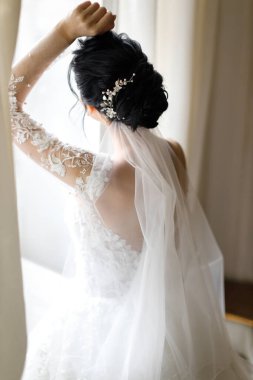 Bride in the morning during wedding preparations.