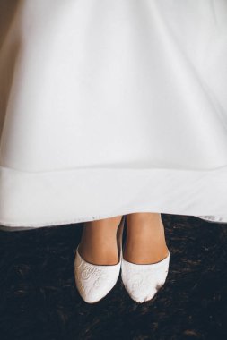 Bride in the morning during wedding preparations.