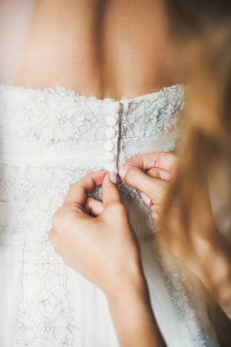 Bride in the morning during wedding preparations.