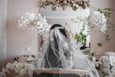 Bride in the morning during wedding preparations.