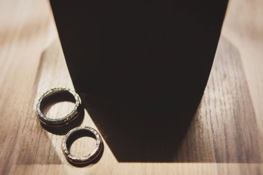Two vintage wedding rings and wooden box.