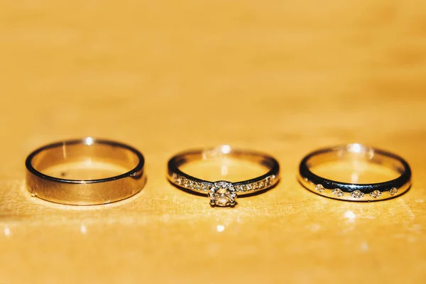 Three Wedding Rings Wooden Table — 스톡 사진