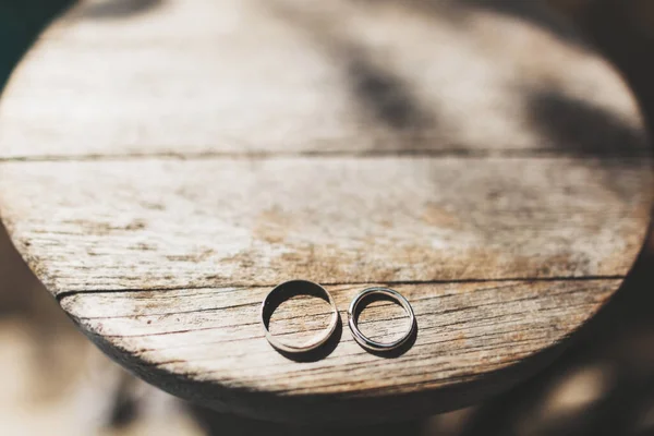 Two Wedding Rings Wooden Table — Zdjęcie stockowe