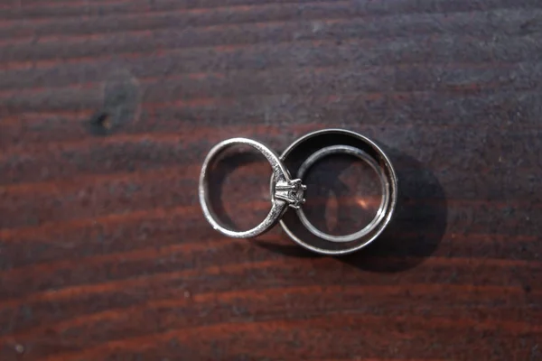 Two Wedding Rings Wooden Table — Zdjęcie stockowe