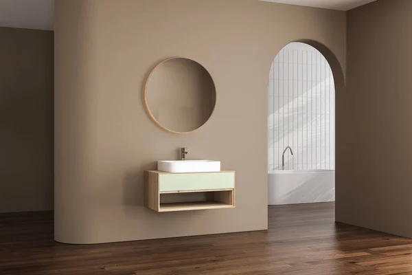 米色简约浴室内部有阳光 椭圆形镜子 白色浴缸 最小设计的概念 3D渲染 — 图库照片