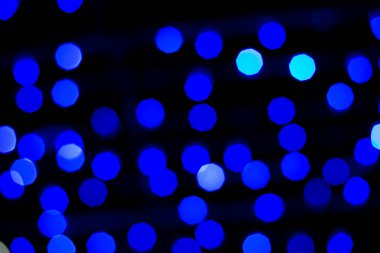 Odaklanmamış Mavi ve Altın soyut bokeh ışıkları arka plan.