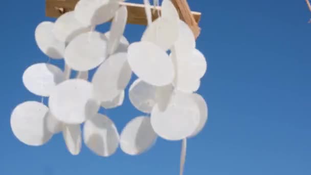 Closeup of Hanging seashells mobile blowing in the wind. — Stock Video