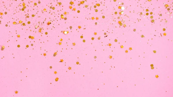 五彩缤纷的金星点缀在粉色的背景上. — 图库照片