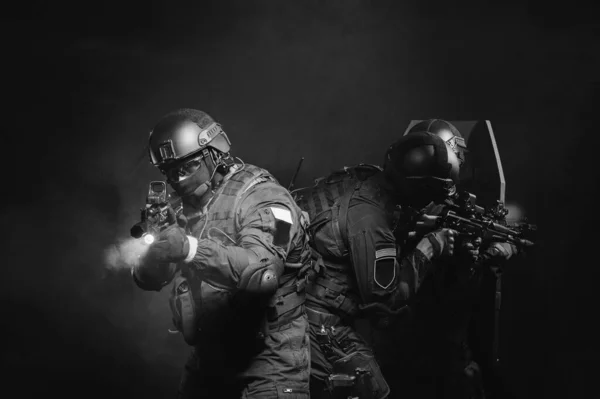 Special Forces during a special operation covers each other in the dark corridors of power. Royalty Free Stock Obrázky