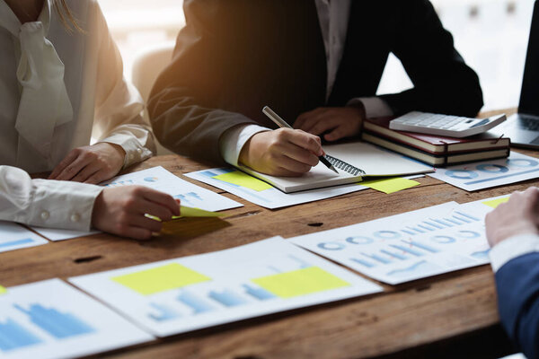 Business team hands at working with financial plan, meeting, discussion, brainstrom with tablet on office desk, Meeting concept.