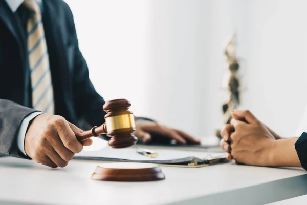 Business woman and lawyers discussing contract papers with brass scale on wooden desk in office. Law, legal services, advice, Justice concept. — Stock Photo, Image