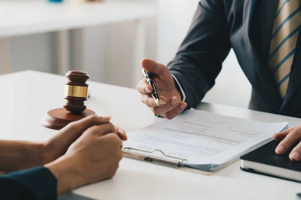 Business woman and lawyers discussing contract papers with brass scale on wooden desk in office. Law, legal services, advice, Justice concept. — Stock Photo, Image