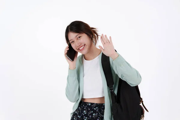 Young college student with backpack isolated over white background. E-learning ,online ,education concept. — Stockfoto