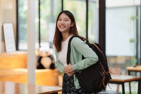 Young college student with backpack at class room. E-learning ,online ,education concept. — 스톡 사진