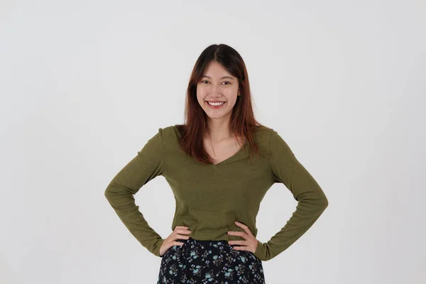 Image of happy young girl standing and Looking camera pointing isolated over white background. — Stockfoto