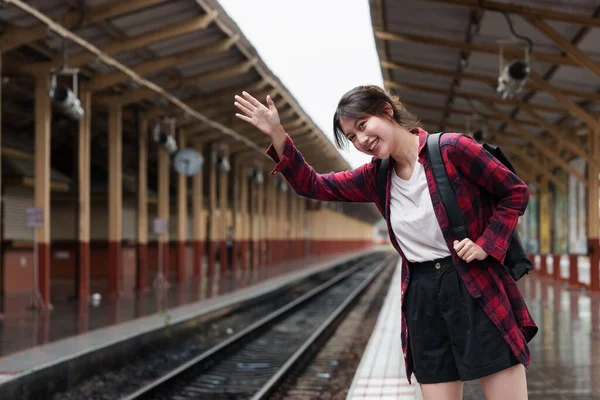 Beautiful traveler with backpack go to summer trip by train. Travel concept. — Stockfoto