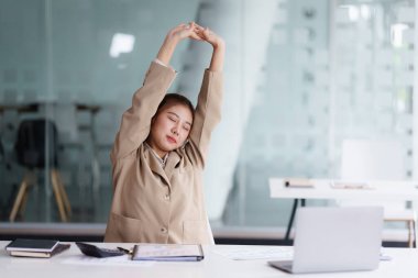 Portrait of Business or Accountant woman relaxing after hard work.