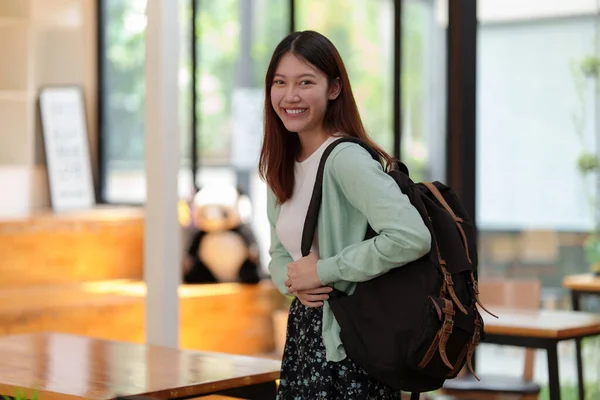Young college student with backpack at class room. E-learning ,online ,education concept. — Stockfoto