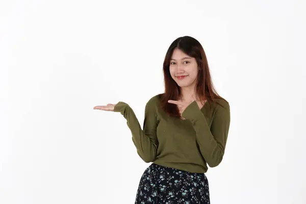 Image of happy young girl standing and Looking camera pointing isolated over white background. — Stockfoto