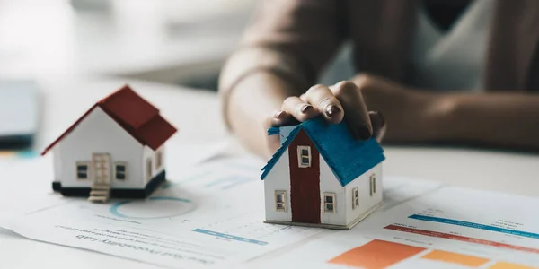 Close up of Business woman choosing house after signing agreement for buying house. Bank manager concept. — Stok fotoğraf