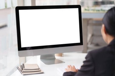Businesswoman or Accountant working on desktop computer at office.