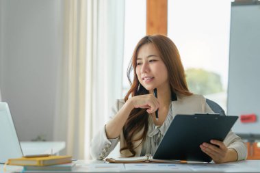 Advisor Business person and analysis reads and writes reports financial of company. Account and audit concept
