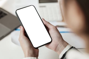 A Woman using cell phone screen. Blank screen for your advertising.