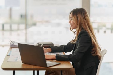 Beautiful young asian business woman at office.