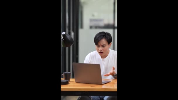 Asian Man Using Laptop Computer Shocking While Have Bad News — Stockvideo