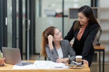 Two Happy business person discuss at workplace.