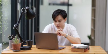 Asian man have video call meeting with partner by laptop computer.