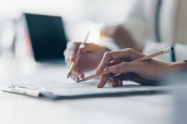 Business team support and meeting concept. Group of Investor working and pointing at financial paperwork Finance task on office desk.