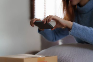 Asian SME business woman working at home office. online shopping concept.