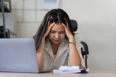 Asian business woman worry about marketing plan of this years. Account, Real Estate Agent, Finance concpet.