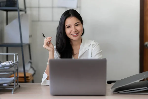 Business asian woman working at home. account and finance concept.