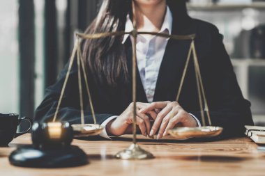 Lawyer business woman working or reading lawbook in office workplace for consultant lawyer concept.