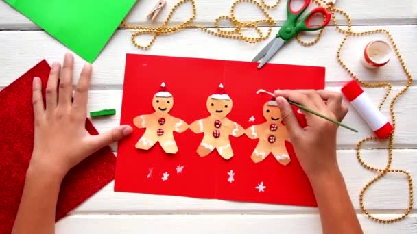 Application for kids. Christmas or New year card with gingerbread man from paper. — Stock Video