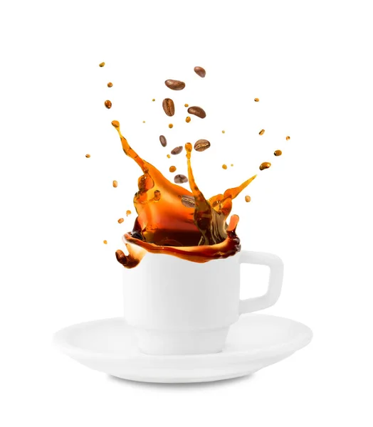 Coffee bean with splash of black coffee in white cup isolated on white background