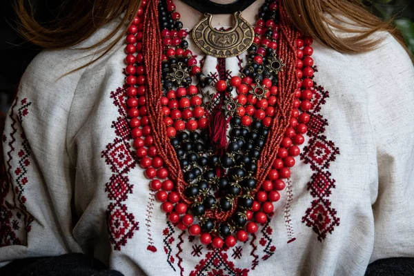 A girl embroiders a traditional Ukrainian vyshyvanka pattern