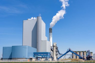 Photo of a large coal and biomass power plant on a sunny summer day. Port of Rotterdam, the Netherlands.