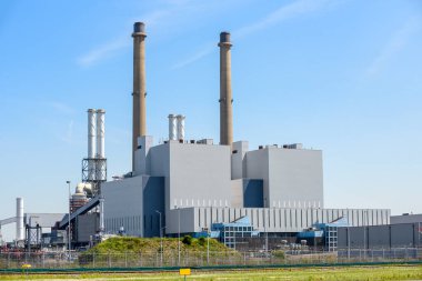 View of a coal-fired power station on a clear summer day. Port of Rotterdam, the Netherlands.