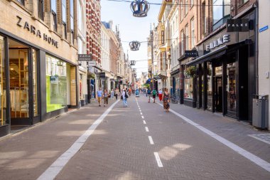 The Hague, Netherlands - June 17, 2022: People stolling along Noordeinde street on a sunny day