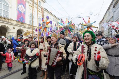 Lviv, Ukraine, 8 January 2022. Carollers during procession of zvizdari (Christmas Star carriers) held as part of the Spalakh rizdvianoi zvizdy (The Flash of the Christmas Star) Festival in Lviv, western Ukraine. Every year, enthusiasts take to the st
